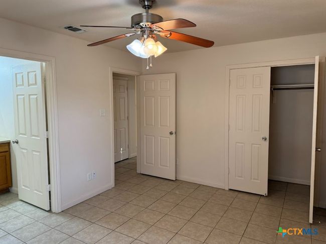 Bedroom view of with great closet space and natural light. | Image 26