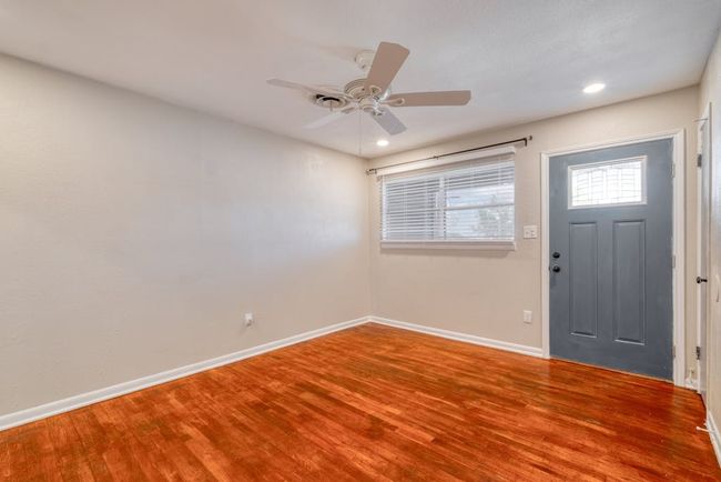 Entrance foyer featuring a ceiling fan, recessed lighting, baseboards, and wood finished floors | Image 6