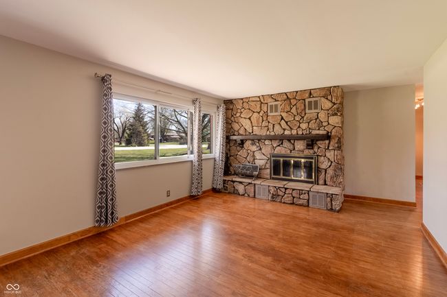 Living Room w/ hardwoods & fireplace | Image 4