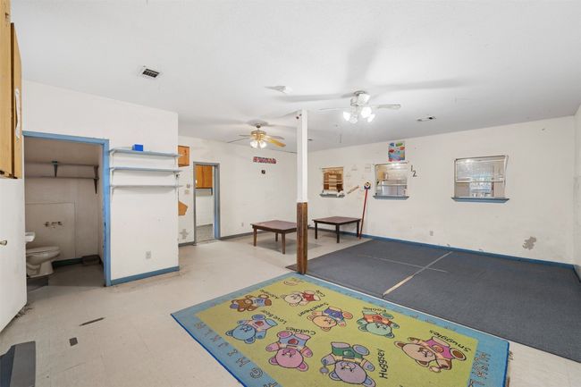 Playroom with visible vents and ceiling fan | Image 14