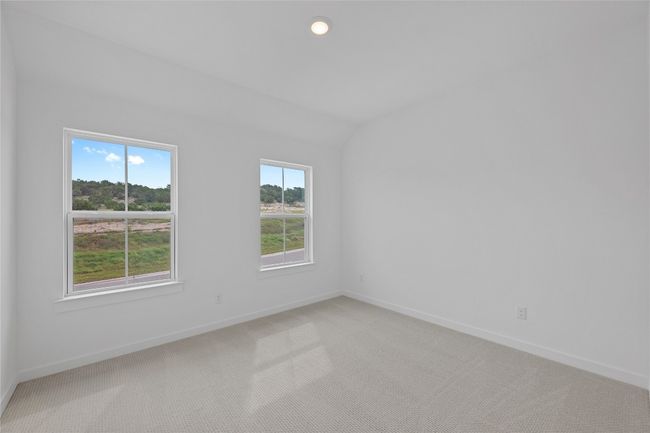 Unfurnished room with light colored carpet, baseboards, lofted ceiling, and recessed lighting | Image 24