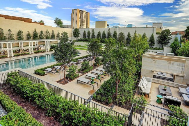 A second view of the vast outdoor area highlighting the firepit conversation area. | Image 31