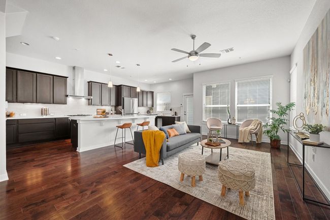 A striking wall of windows frames the living room, filling the space with natural light | Image 8