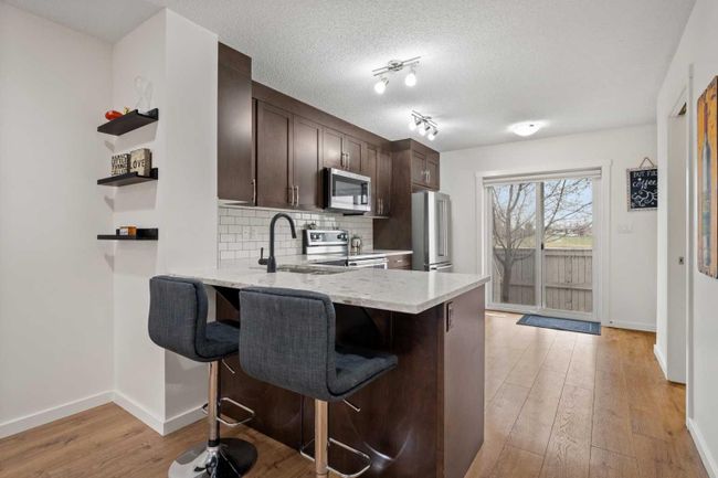 1304 - 2400 Ravenswood View Se, Home with 3 bedrooms, 2 bathrooms and 1 parking in Airdrie AB | Image 8