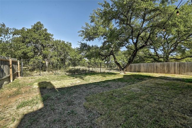 View of fenced backyard | Image 28