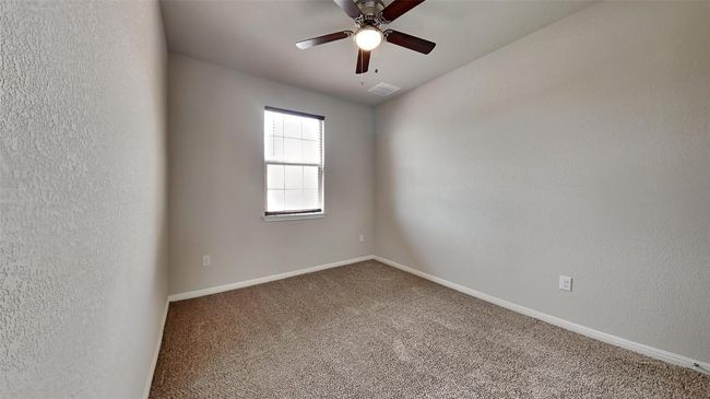 Unfurnished room featuring carpet floors, a ceiling fan, and baseboards | Image 7