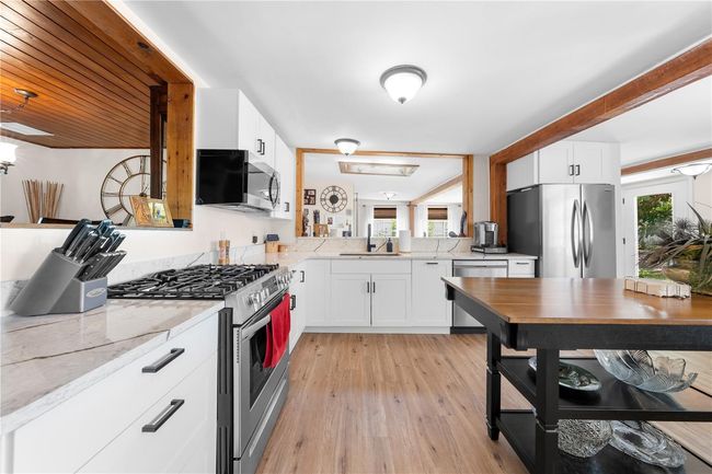 Main Home - Enjoy cooking on your gas stove in this bright and airy fully remodeled kitchen. | Image 20