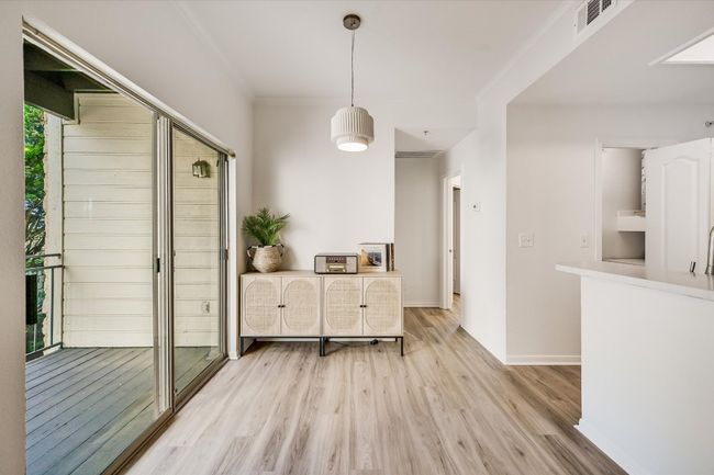 Dining room featuring light wood-style floors and ornamental molding | Image 6