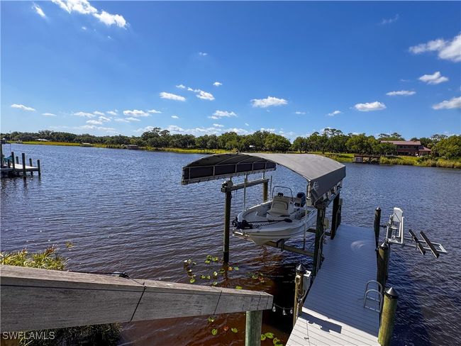 View of dock with boat lift and a water view | Image 6