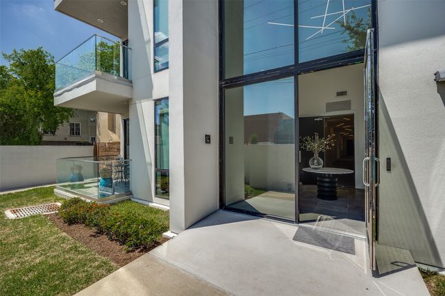 Doorway to property with stucco siding | Image 35