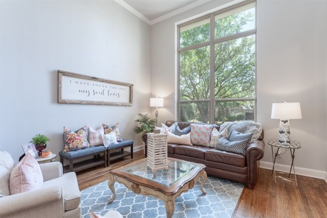Living area featuring wood finished floors and crown molding | Image 8
