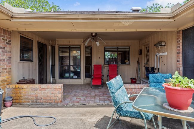 View of patio with outdoor dining area | Image 32