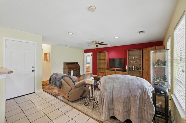 Living area featuring visible vents, light tile patterned floors, a ceiling fan, and recessed lighting | Image 10