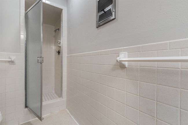 Glass door shower with tile | Image 29