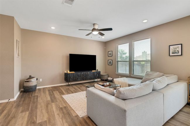 Living room with a ceiling fan, wood finished floors, and recessed lighting | Image 8