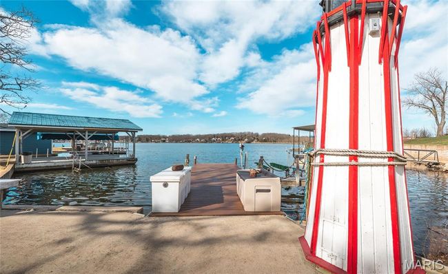 View of dock featuring a boat lift. | Image 48