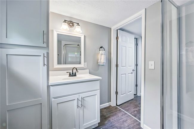 Updated bathroom with linen storage | Image 26