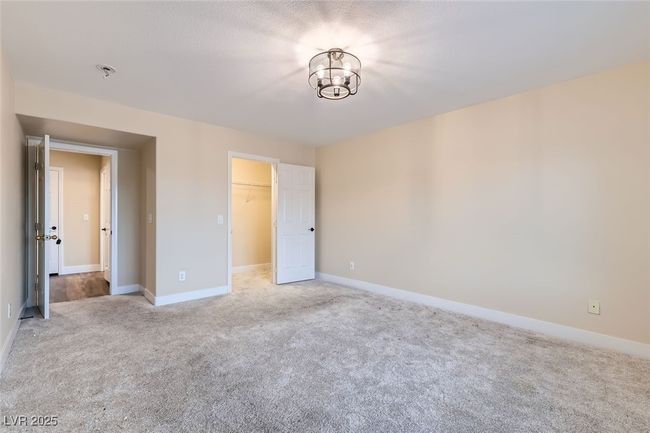 Unfurnished bedroom with carpet and a spacious closet | Image 26