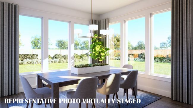 With windows everywhere you look, this dream dining room is the perfect place to host grand dinner parties or cozy family gatherings. REPRESENTATIVE PHOTO VIRTUALLY STAGED | Image 10