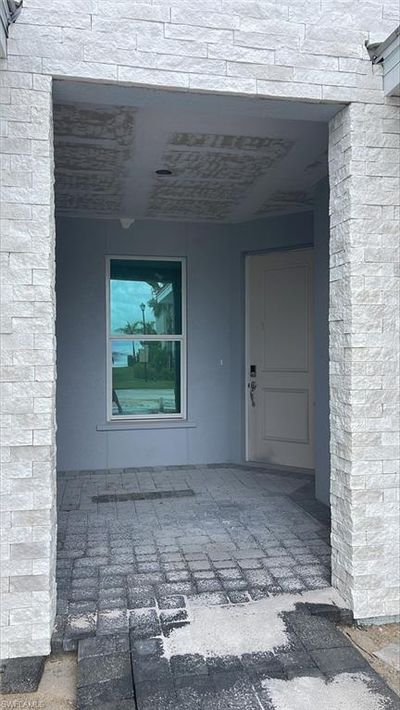 Private front door entrance and covered front patio space | Image 2