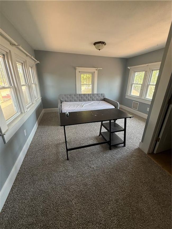 Bedroom with carpet and multiple windows | Image 35