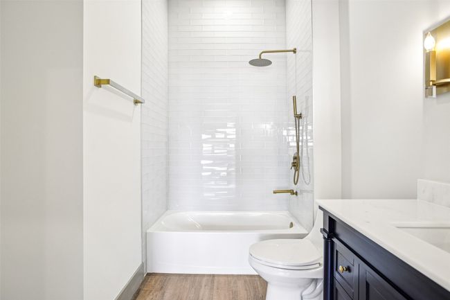 Bathroom with vanity, light wood-type flooring, and shower combination | Image 24