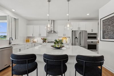 (*Photo of decorated model, actual homes colors and finishes will vary) Imagine preparing a meal for your loved ones in this space! | Image 2