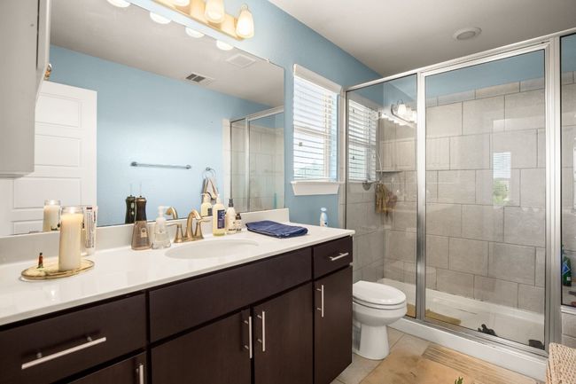 The en-suite bathroom features a spacious walk-in shower with modern fixtures. | Image 15