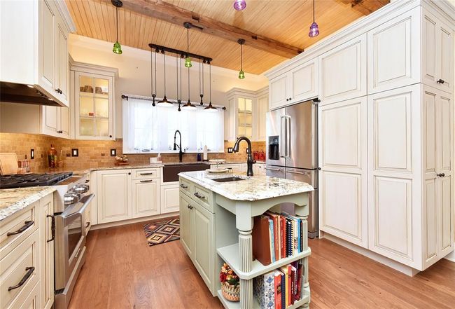The Guest house kitchen. This home was also remodeled less than 5 years ago. This kitchen has a massive amount of storage. All appliances, art, etc. stay with this home as well. | Image 36