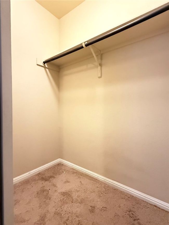 Spacious closet with carpet flooring | Image 16