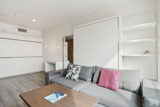 Living area featuring recessed lighting, visible vents, and wood finished floors | Image 7