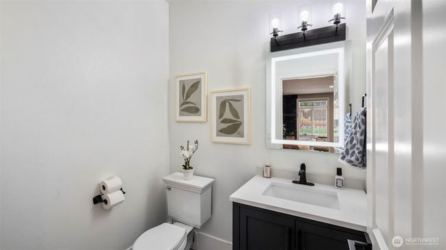 This convenient half bathroom downstairs is perfect for everyday use and guests | Image 14