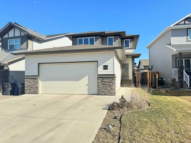 70 Moonlight Boulevard W, Home with 4 bedrooms, 3 bathrooms and 4 parking in Lethbridge AB | Image 2