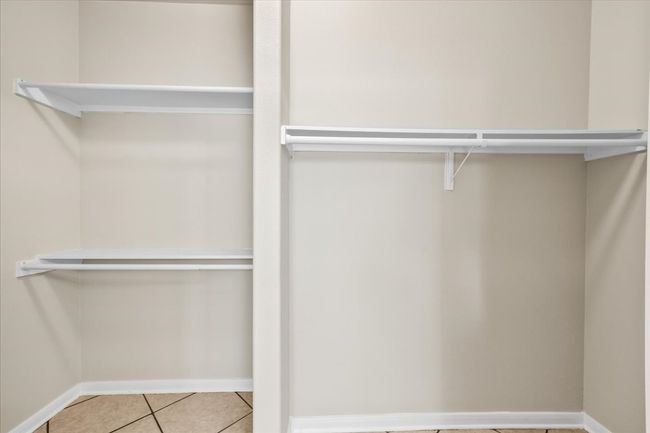 Walk in closet with tile patterned floors | Image 18
