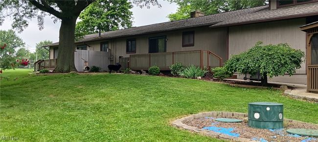 View of grassy yard featuring a deck | Image 21