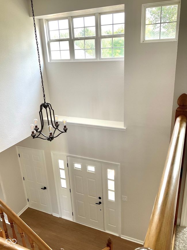 Bright and open upper hallway with new carpet and paint. | Image 36