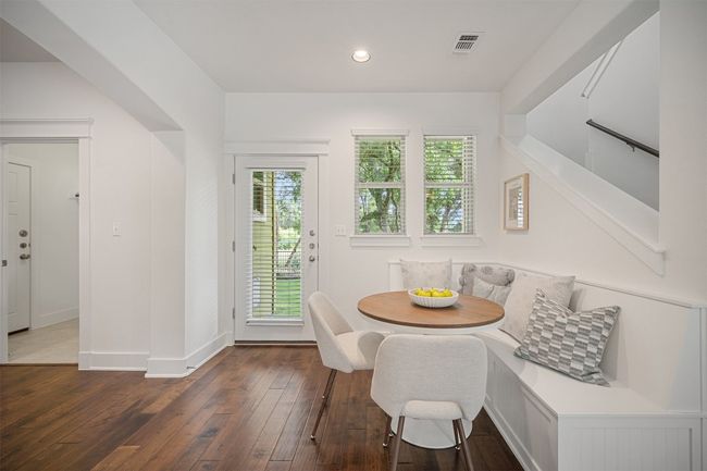 With its charming built-in bench seat, the dining area offers a unique spot for enjoying meals while soaking in the view of the peaceful surroundings | Image 18