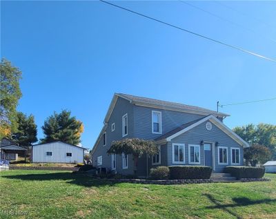 View of front facade with a front yard | Image 1