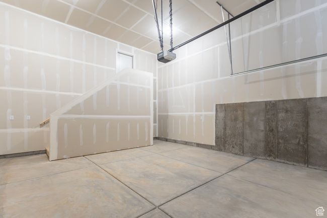 Garage with a garage door opener | Image 28