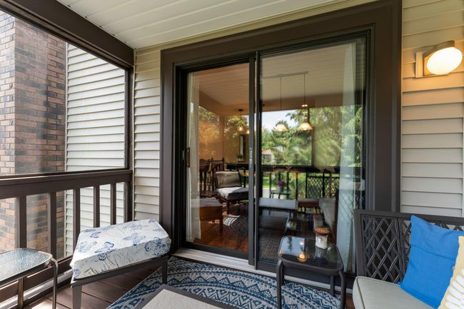 Sliding glass door to the upper level of the home. | Image 14