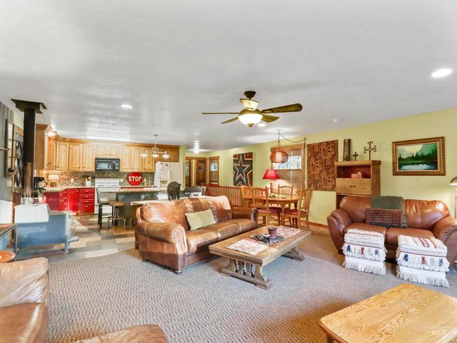 Living room featuring a ceiling fan, recessed lighting, and carpet flooring | Image 23