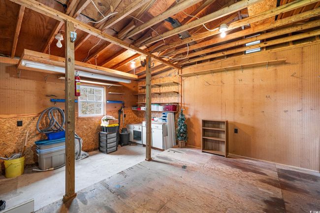 Misc room featuring a workshop area | Image 32