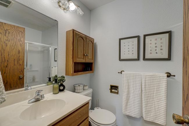 Convenient 3/4 bath located on the main level, offering easy access and comfort for guests or daily use | Image 21