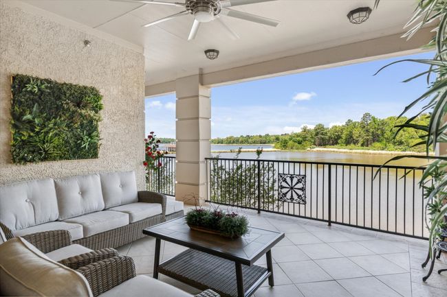 Balcony featuring a water view, a ceiling fan, and outdoor lounge area | Image 22