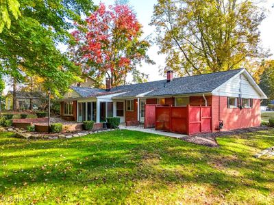 Rear view of property featuring a lawn | Image 3