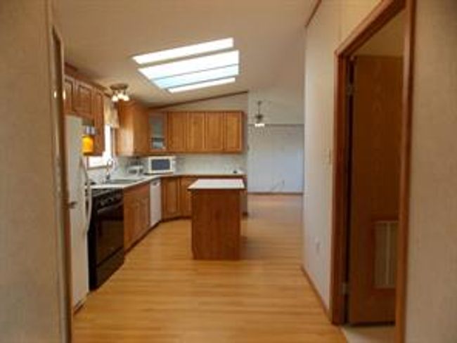 77 - 5210 65 Ave, Home with 3 bedrooms, 2 bathrooms and 3 parking in Olds AB | Image 16