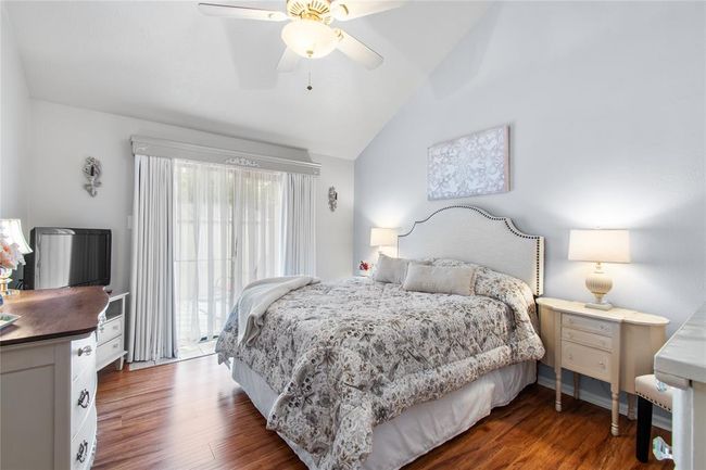 Primary Bedroom on the main floor. Slider to the backyard. High ceilings. Laminate floors. | Image 12