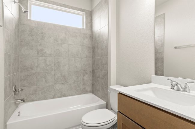 Bathroom with vanity and bathing tub / shower combination | Image 29