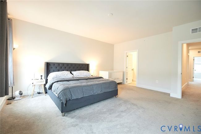 Bedroom with light colored carpet and baseboards | Image 9