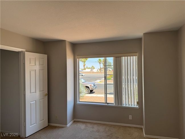 Unfurnished room with carpet floors and baseboards | Image 10
